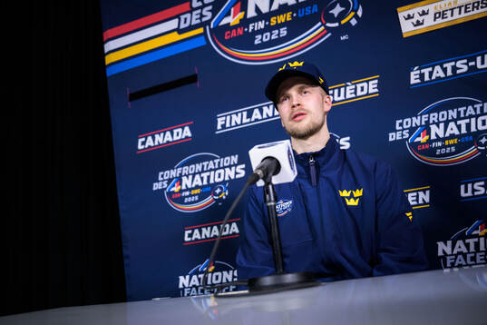 Elias Pettersson of Sweden being interviewed by media