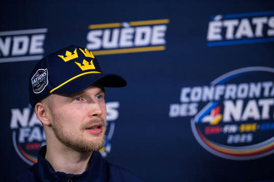 Elias Pettersson of Sweden being interviewed by media