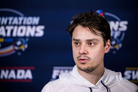 Sebastian Aho of Finland is being interviewed by media