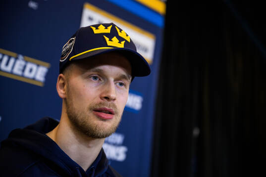 Elias Pettersson of Sweden is being interviewed by media