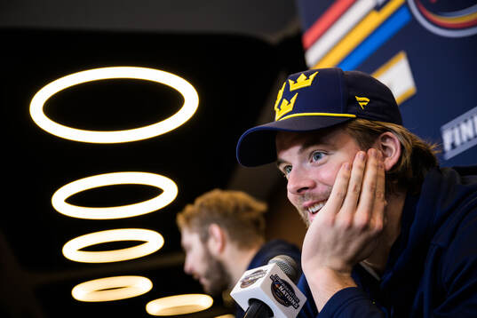 Goaltender Samuel Ersson of Sweden is being interviewed by