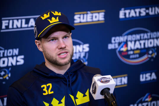 Goalkeeper Filip Gustavsson of Sweden is being interviewed