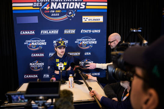 Is being interviewed by media