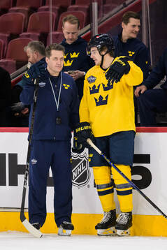 Head coach Sam Hallam and Leo Carlsson of Sweden at a