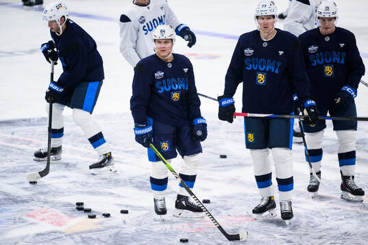 Mikael Granlund, Niko Mikkola and Anton Lundell of Finland