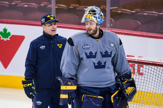 Head coach Sam Hallam and goaltender Linus Ullmark of