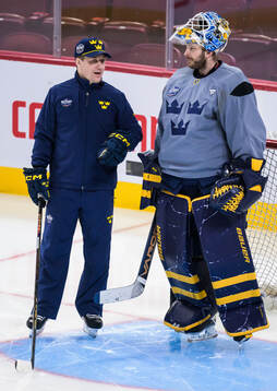 Head coach Sam Hallam and goaltender Linus Ullmark of