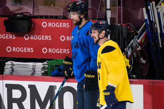 Victor Hedman and Erik Karlsson of Sweden at a practice