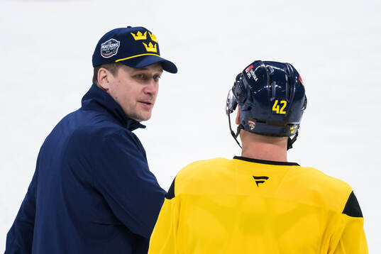 Head coach Sam Hallam and Gustav Forsling of Sweden at a