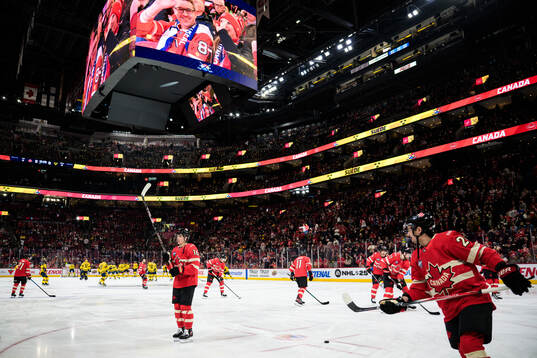 Players of Canada and Sweden at warm-up