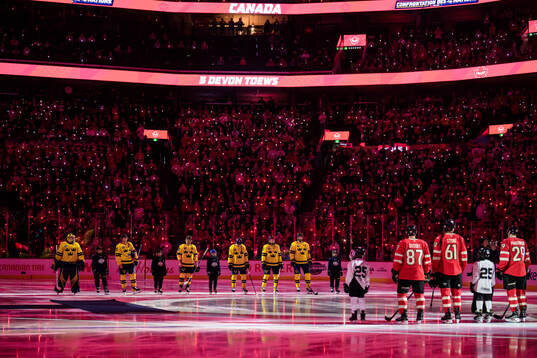 Players of Sweden and Canada