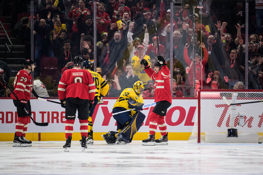 Nathan MacKinnon, Cale Makar and Sam Reinhart of Canada