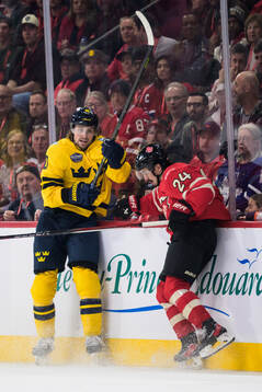 Adrian Kempe of Sweden and Seth Jarvis of Canada