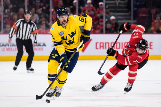 Erik Karlsson of Sweden and Anthony Cirelli of Canada