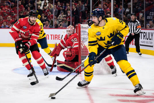 Shea Theodore and goaltender Jordan Binnington of Canada