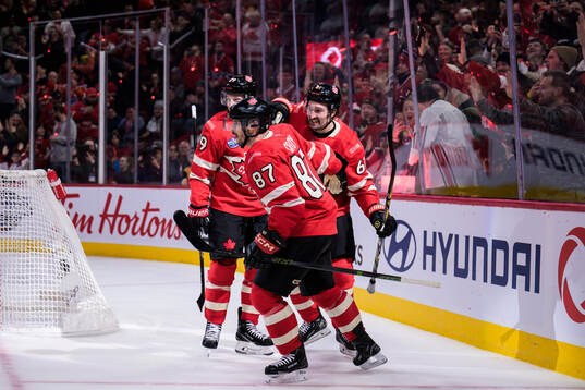 Nathan MacKinnon, Sidney Crosby and Mark Stone of Canada