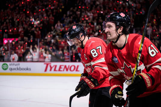 Sidney Crosby and Mark Stone of Canada celebrate the 3-1