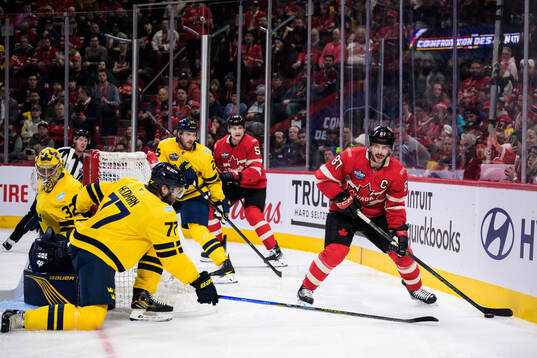Goaltender Filip Gustavsson and Victor Hedman of Sweden are