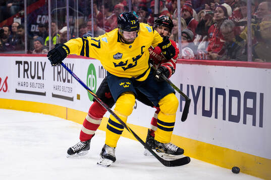 Victor Hedman of Sweden and Sidney Crosby of Canada