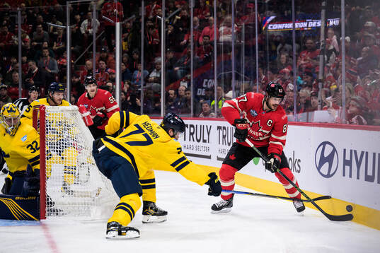 Victor Hedman of Sweden is being challenged by Sidney