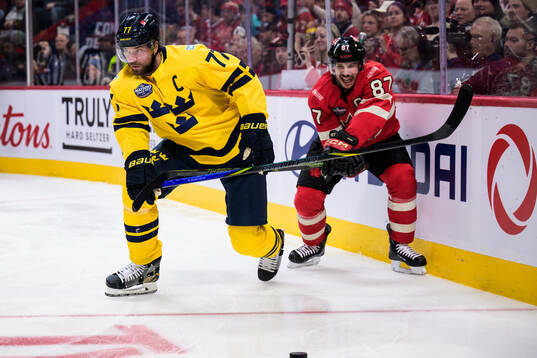 Victor Hedman of Sweden and Sidney Crosby of Canada