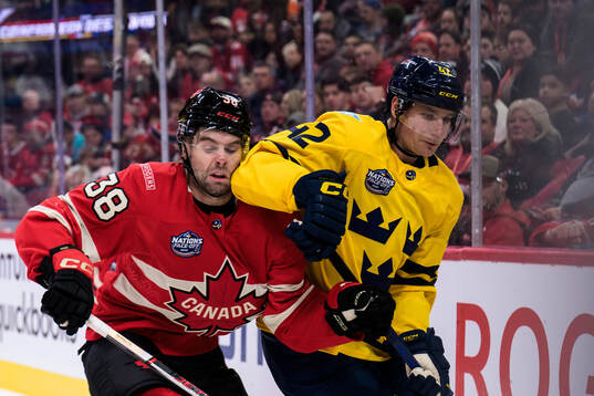 Brandon Hagel of Canada and Gustav Forsling of Sweden