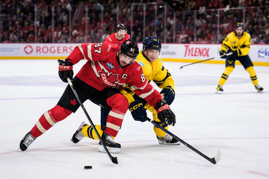 Sidney Crosby of Canada and Gustav Forsling of Sweden