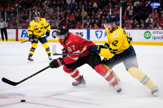 Sidney Crosby of Canada and Gustav Forsling of Sweden
