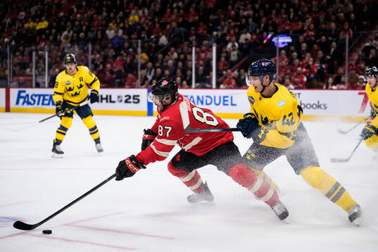 Sidney Crosby of Canada and Gustav Forsling of Sweden