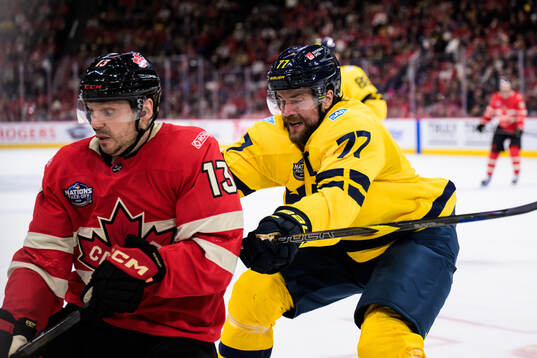 Sam Reinhart of Canada and Victor Hedman of Sweden