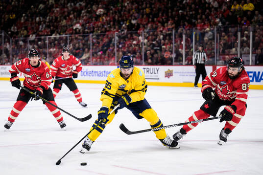 Erik Karlsson of Sweden and Drew Doughty of Canada