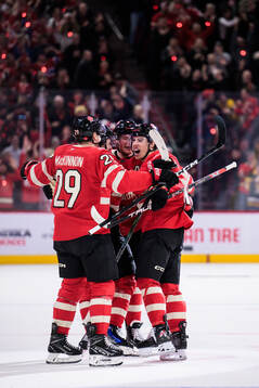 Mitch Marner of Canada celebrates with teammates