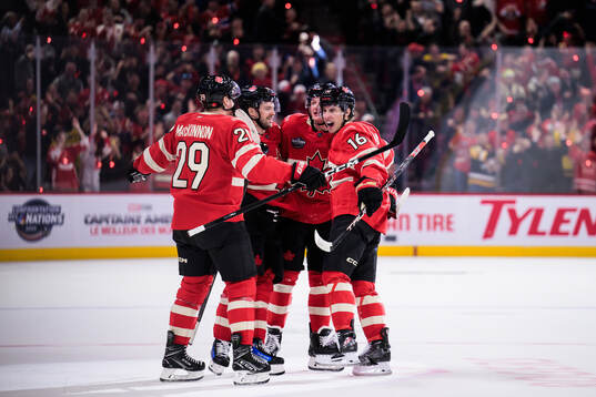 Mitch Marner of Canada celebrates with teammates