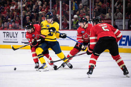 Seth Jarvis of Canada and Elias Pettersson of Sweden