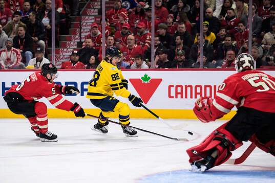 Devon Toews of Canada and William Nylander of Sweden