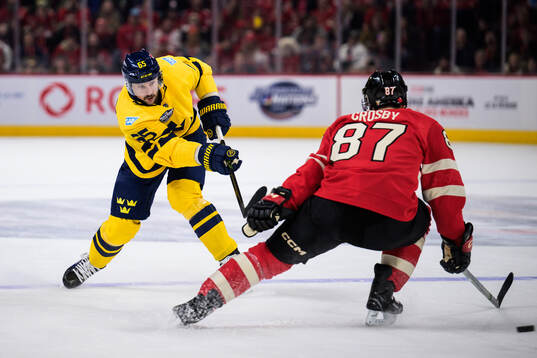 Erik Karlsson of Sweden and Sidney Crosby of Canada