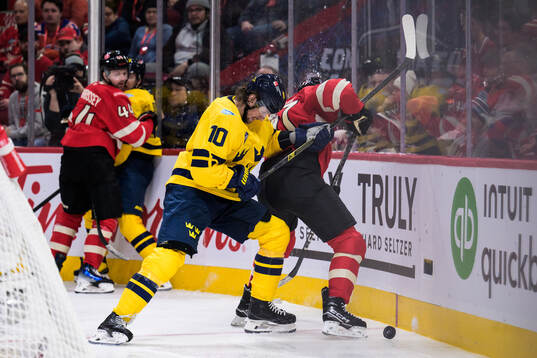 Adrian Kempe of Sweden and Connor McDavid of Canada