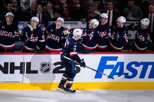 Brady Tkachuk of USA celebrates with teammates