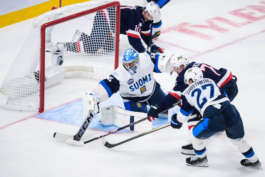 Goaltender Juuse Saros and Eetu Luostarinen of Finland are