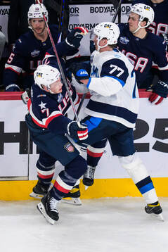 Brady Tkachuk of USA and Niko Mikkola of Finland