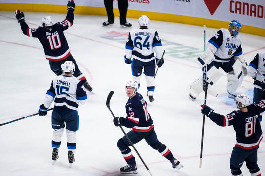 J.T. Miller, Matt Boldy and Kyle Connor of USA celebrate