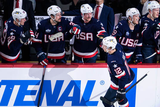 Matt Boldy of USA celebrates with teammates