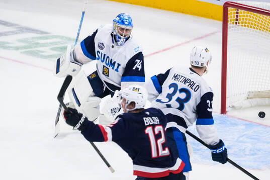 Goaltender Juuse Saros of Finland looks dejected