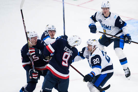 Brady Tkachuk and Jack Eichel of USA in action against