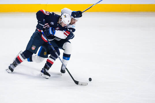 Matthew Tkachuk of USA and Roope Hintz of Finland
