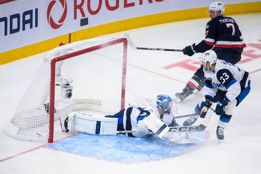 Brady Tkachuk of USA scores 5-1 behind goaltender Juuse