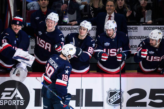 Matthew Tkachuk of USA celebrates with teammates including