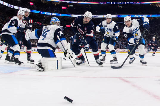 Goaltender Juuse Saros and Henri Jokiharju of Finland are