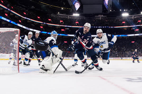 Goaltender Juuse Saros and Henri Jokiharju of Finland are