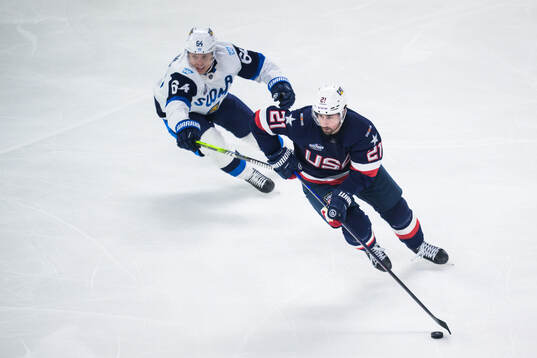 Mikael Granlund of Finland and Dylan Larkin of USA